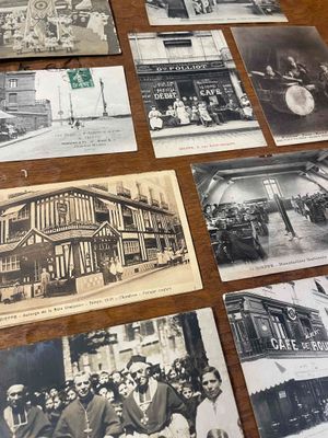 many old black and white photos of people on the table