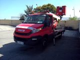 a red truck that is parked in a parking lot