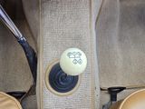 a picture of a car ' s center console with a sticker on it