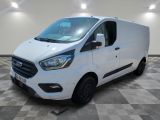 a white ford transit van parked in a room with a checkered floor