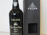 a bottle of wine that is next to a box