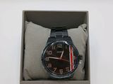 the watch is in a box on a white surface
