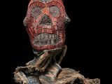 a close up of a statue of a person wearing a mask