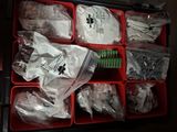 many plastic containers filled with different types of items