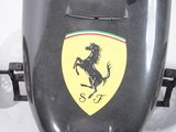 a black car with a ferrari logo on the side