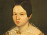 portrait of a woman in a brown dress with a white lace