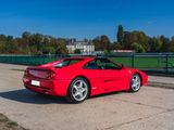 a red sports car parked on the side of the road