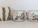 three vases sitting next to each other on a table
