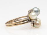 an image of a close up of a ring with pearls on it