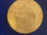 an image of a gold coin on a blue cloth