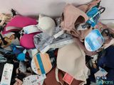 a pile of shoes and other items that are on the floor