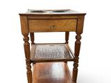 an image of a small wooden table with a basket on top of it