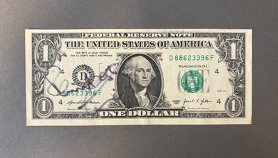 une image d'un billet d'un dollar sur lequel figure le portrait de George Washington