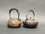 pair of chinese bronze teapots with handles and handles