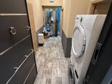 a washer and dryer in the hallway of a building