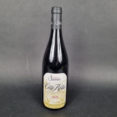 a bottle of wine sitting on top of a table