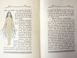 an open book with a drawing of a woman on it