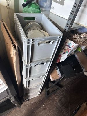 a stack of boxes and other items in a room