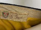 an image of a close up of a purse with a label on it