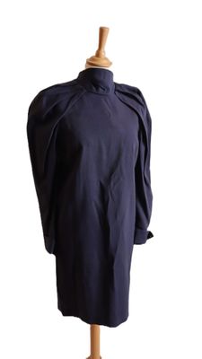 an image of a dress on a mannequin stand