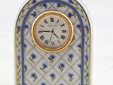 a small clock that is sitting on a table