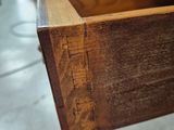 a close up of a wooden drawer in a room