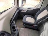 a picture of the inside of a vehicle with the driver ' s seat up