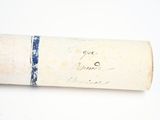 a roll of paper with writing on it sitting on a table
