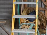 a ladder that is sitting in the middle of a room