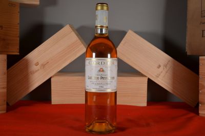 a bottle of wine that is sitting on a table