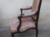a chair that is sitting in front of a wall