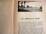 un livre ouvert sur lequel figure l'image d'un paysage