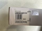 someone is holding a box with a barcode on the side of it