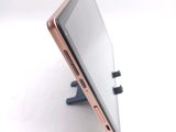 a close up of a cell phone on a stand