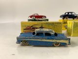 three toy cars are sitting next to each other on a table