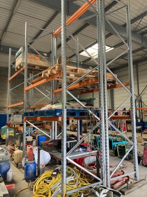 a picture of a warehouse filled with lots of shelves