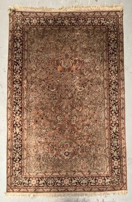 an antique persian rug is displayed on a white wall