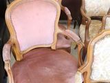 a lot of chairs that are sitting in a room