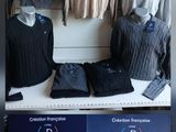 a lot of sweaters on display in a store