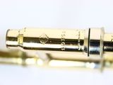 a close up view of a flute with a gold finish