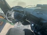 a view of the inside of a vehicle from the driver ' s seat