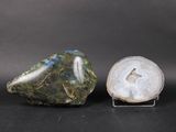two pieces of green and white agite on a black surface