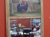 un miroir sur lequel figure l'image d'une femme et d'un homme