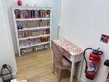 a desk with a chair and a fire extinguisher in the corner