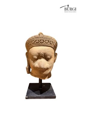 an image of a statue of a head with a crown on it ' s head