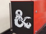 a black and red sign with a dragon on it