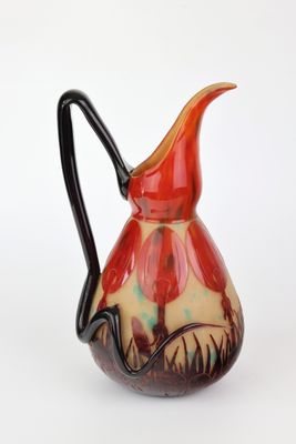 an image of a red and black pitcher on a white background