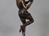 bronze statue of a man holding a football glove