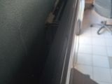 a black door handle on the side of a wall