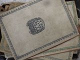 several pieces of paper with a design on them sitting on top of a table